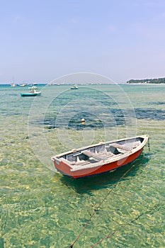 Wooden boat in shallow water