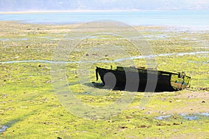 Wooden boat on the shore. photo stock photo