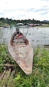 Wooden boat stop on floating bamboo platform