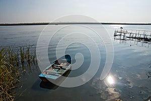 Wooden boat on the water near the shore