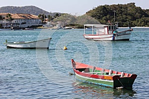 Wooden boats anchored in connection channel with the sea