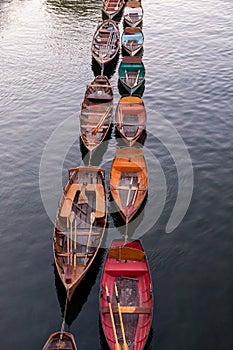 Wooden boats for hire moored on the River Thames, London