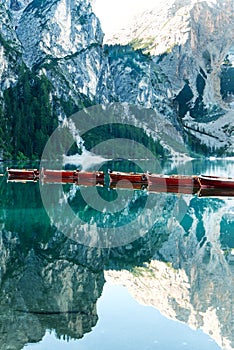 Wooden boats on Lake Braies in Dolomites, Sudtirol, Italy. mountains