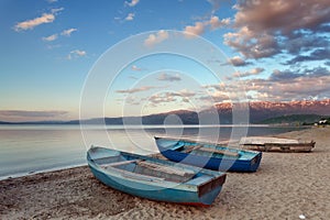 Wooden boats moored on the beach of Lake Ohrid, Pogradec, Albania photo