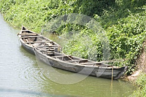 Wooden boats on river banks