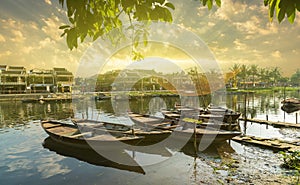 Wooden boats on the Thu Bon River in Hoi An , Vietnam