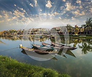 Wooden boats on the Thu Bon River in Hoi An , Vietnam