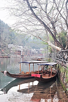 Wooden boats in Tuojiang River Tuo Jiang River in Fenghuang old city Phoenix Ancient Town,Hunan Province, China