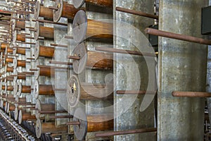 Wooden bobbins on rack