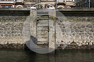 Wooden bollard with stairs in the Rotterdam harbour