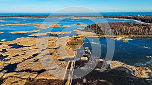 Wooden Bords Trail Through the Kaniera Lake Reeds Aerial Spring Shot Lapmezciems, Latvia.