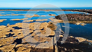 Wooden Bords Trail Through the Kaniera Lake Reeds Aerial Spring Shot Lapmezciems, Latvia.