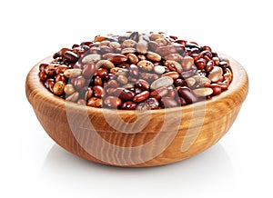 Wooden bowl with beans on white background.