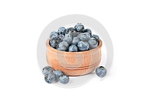 Wooden bowl with blueberries isolated