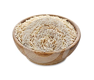 Wooden bowl with brown rice isolated on white