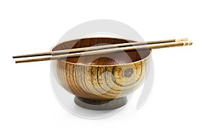 Wooden bowl and chopsticks isolated