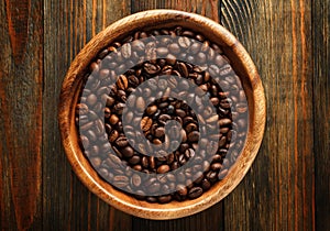 Wooden bowl with a coffee beans