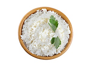 Wooden bowl with cooked rice and parsley isolated, top view
