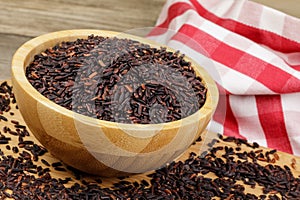 Wooden Bowl of delicious and healthy Black Rice
