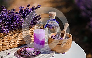 Wooden bowl with dried lavender on field background. Flower herbal tea drink. Aromatherapy, medicine ingredient. Calming beverage