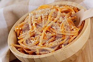Wooden bowl filled with Spaghetti with Marinara Sauce