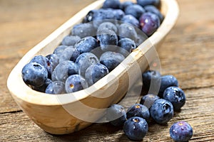 Wooden Bowl of Fresh Blueberries, Nutritious Fruit in Small Bowl