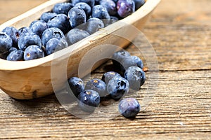 Wooden Bowl of Fresh Blueberries, Nutritious Fruit in Small Bowl