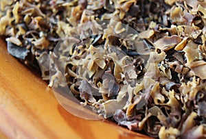 A wooden bowl full of Irish Moss seaweed, for beer brewing