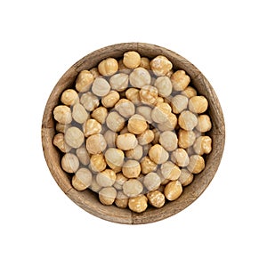 wooden bowl of hazelnuts isolated on white background