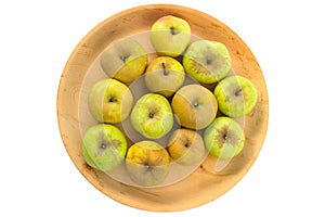 Wooden bowl of imperfect looking organic apples with unconventionally raised method, no GMO techniques. photo