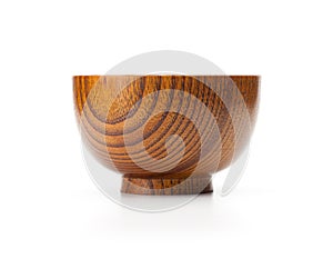 Wooden bowl isolated on white photo