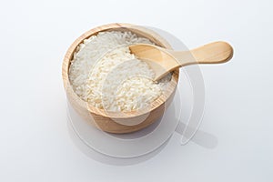 Wooden bowl of jasmine rice grain