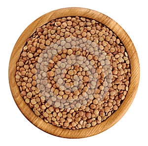 Wooden bowl with lentils on white background.