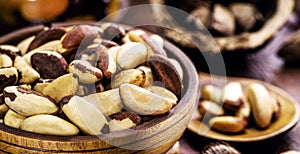 Wooden bowl with many Bertholletia excelsa, popularly known as chestnut of the amazon, chestnut of acre, Brazil nut, bolivian