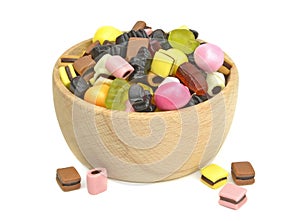 A wooden bowl of mixed sweets