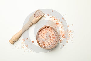 Wooden bowl and scoop with pink himalayan salt on white background