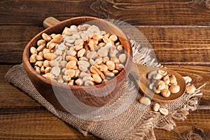 Dry Roasted Peanuts in a Wooden Bowl photo