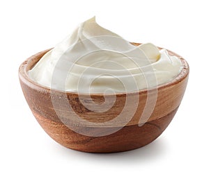 Wooden bowl of whipped sour cream yogurt