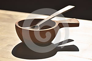 Wooden bowl with wooden spoon