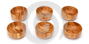 Wooden bowls isolated on white. Set of empty wood bowls round form in different angles shots in collage for your design.