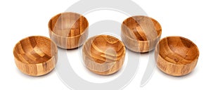 Wooden bowls isolated on white. Set of empty wood bowls round form in different angles shots in collage for your design.