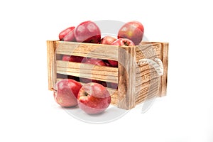 Wooden box with apples isolated on white background