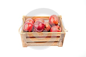 Wooden box with apples isolated on white background