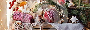 Wooden box with delicious homemade gingerbread cookies with white icing. Perfect beautiful gift in rustic style. Orange, cones,