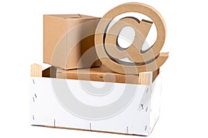 Wooden box filled with arrobas cardboard to deliver packages with an at sign arobase