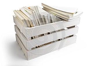 Wooden box of fruit apples in white full of magazines and book