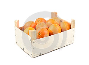 Wooden box of oranges isolated