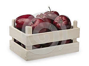 Wooden box with red apples isolatd.