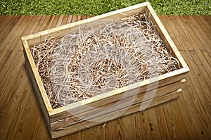 Wooden box with shredded paper