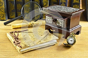 Wooden box with watch and notepad